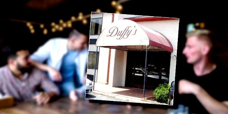 What did Duffy's employees and customers have to say about Andy's behavior that last night? People chatting at a table in a bar with a photo of the Duffy's Bar & Grill entrance in the foreground